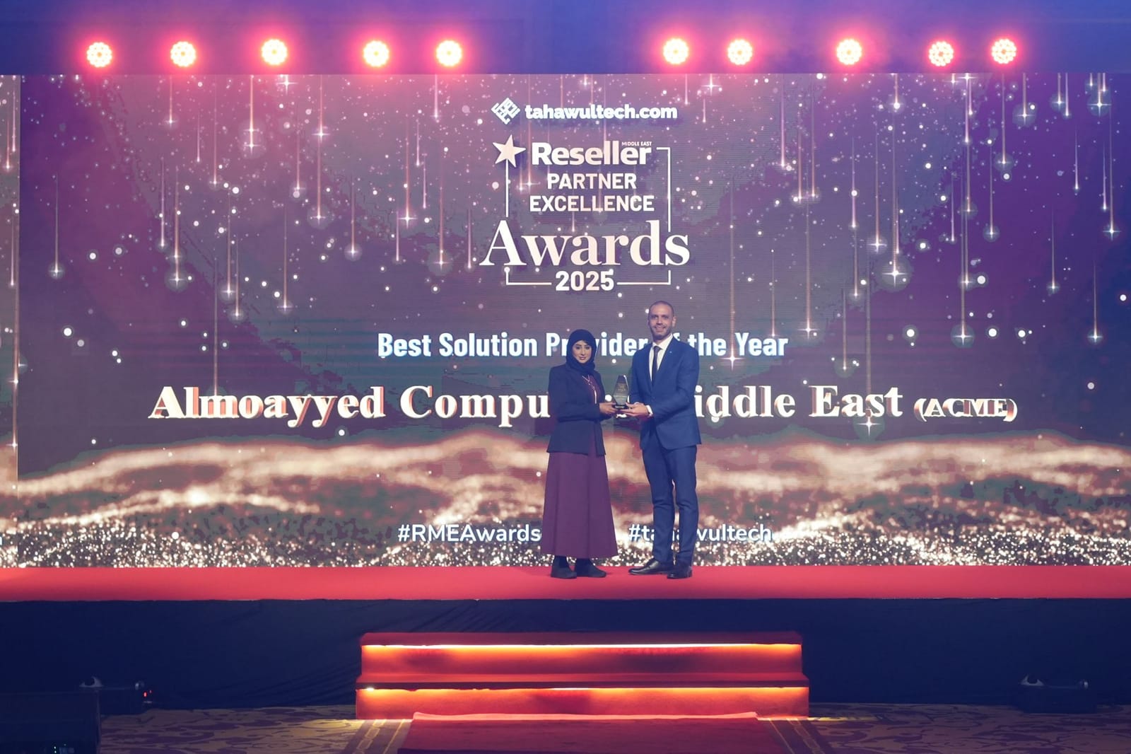 ACME accepting the Best Solution Provider of the Year award on stage at the Tahawultech Reseller Partner Excellence Awards 2025